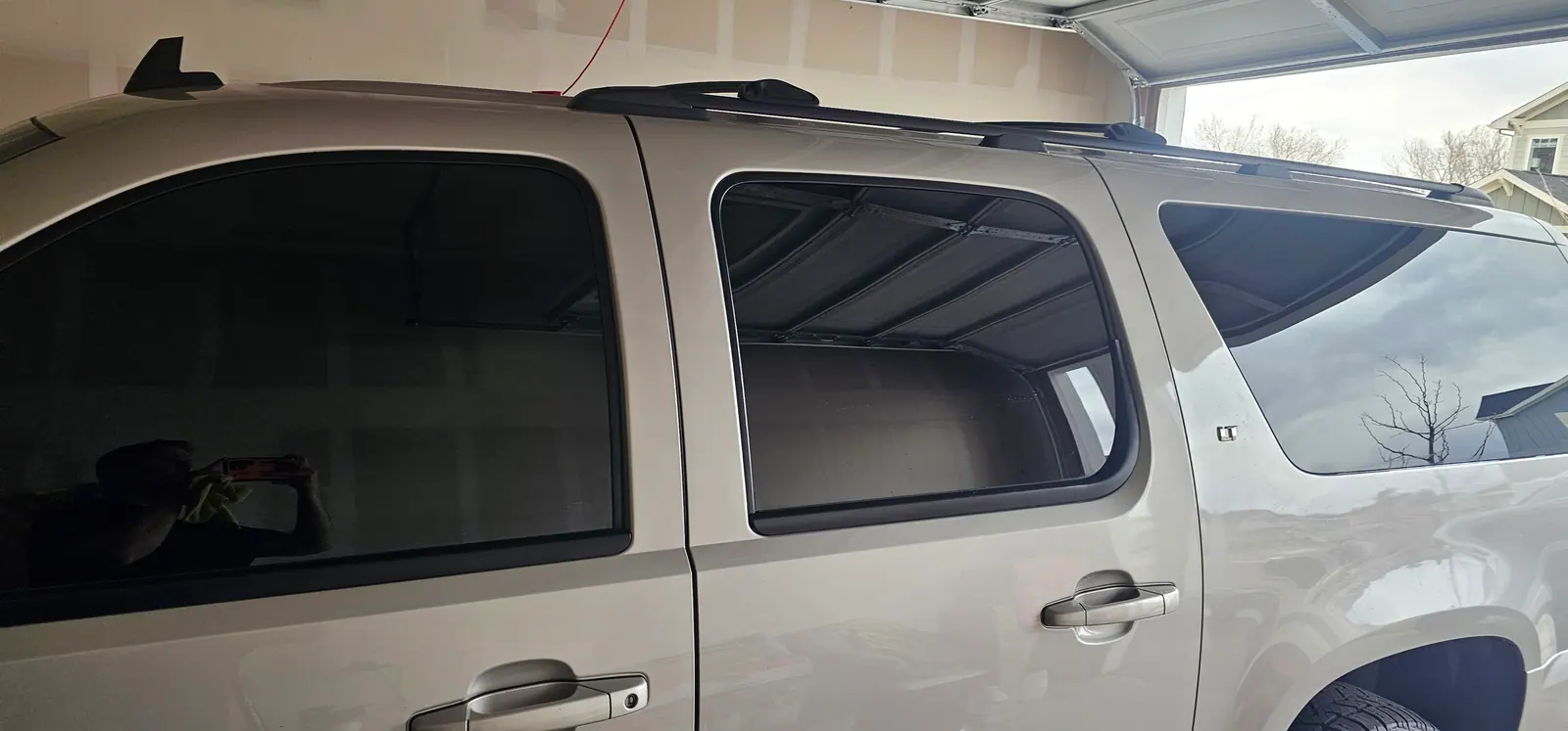 Tan SUV with tinted quarter glass