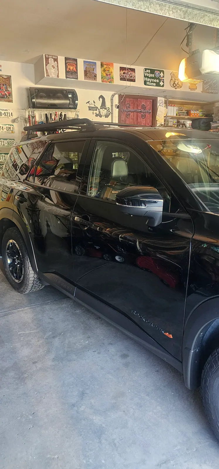 Black Nissan Pathfinder with tint on the side glass