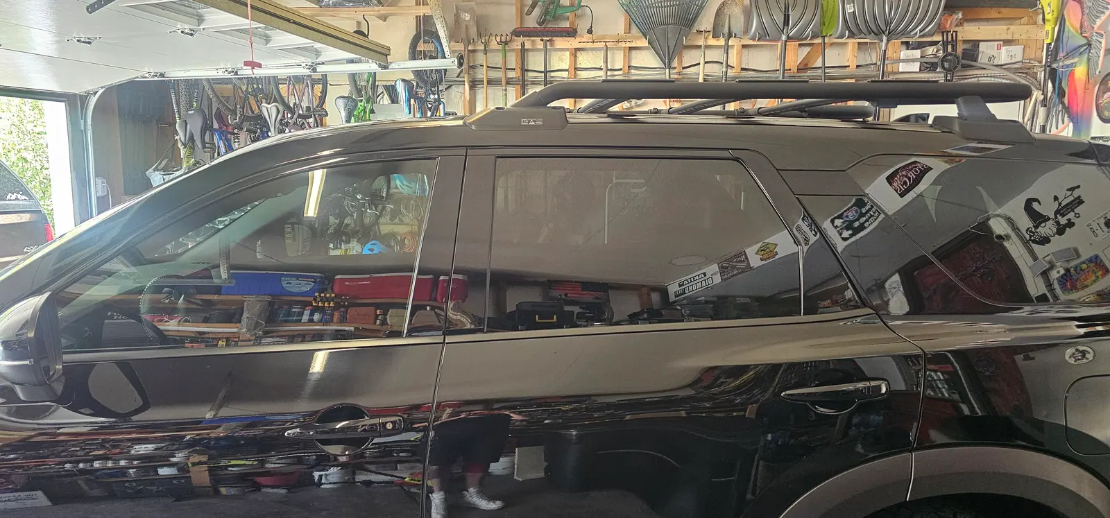 Dark SUV tinted, parked in the shop