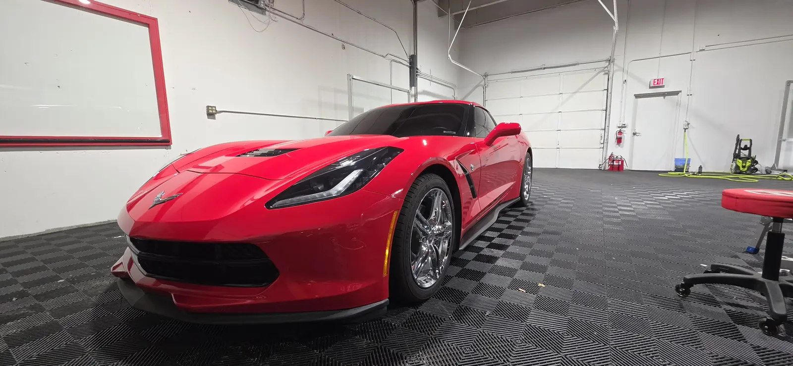 Freshly ceramic coated red Corvette Stingray, front three quarter view
