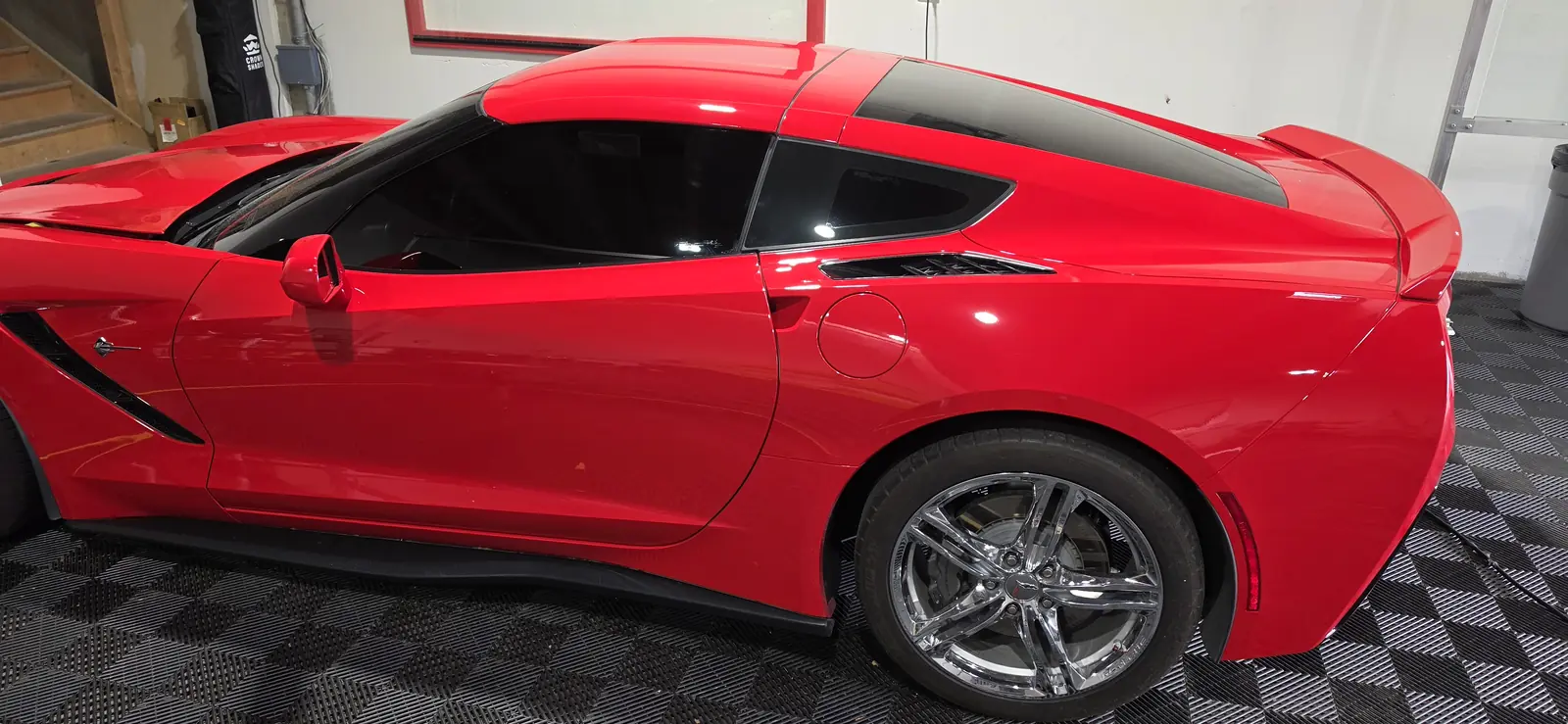 Rear three quarter of a red Corvette Stingray after ceramic coating