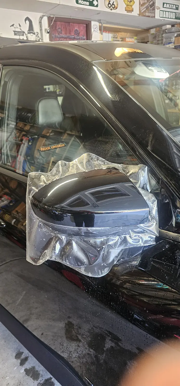 Side mirror cap wrapped in clear protection film