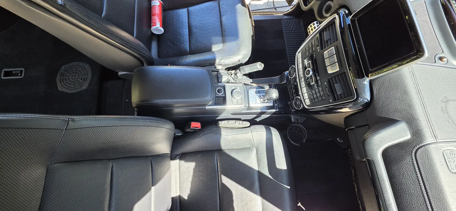 Centre console and front seats of a Mercedes G-Class after an interior detail