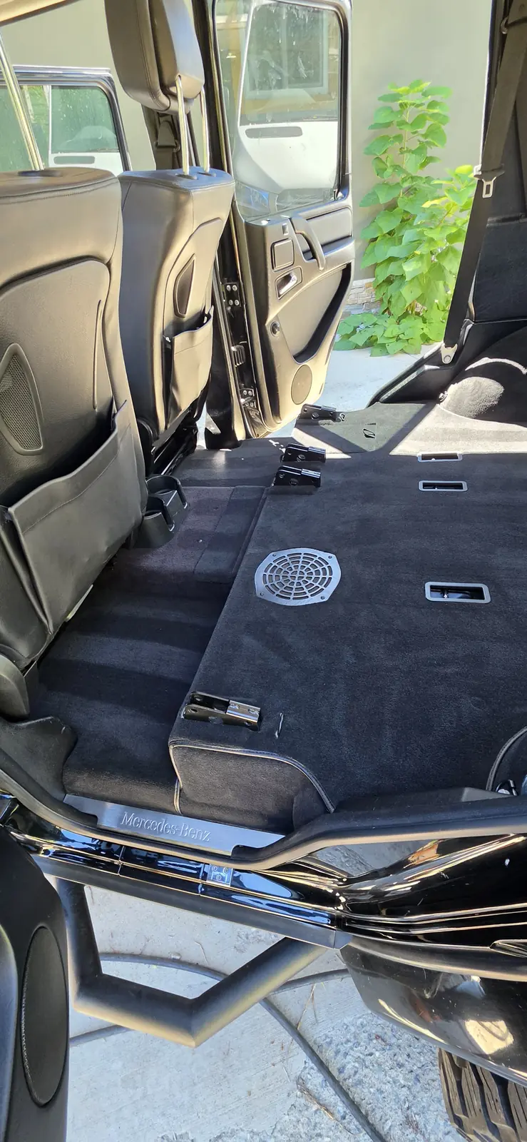 Door sill and carpet of a Mercedes G-Class after an interior detail