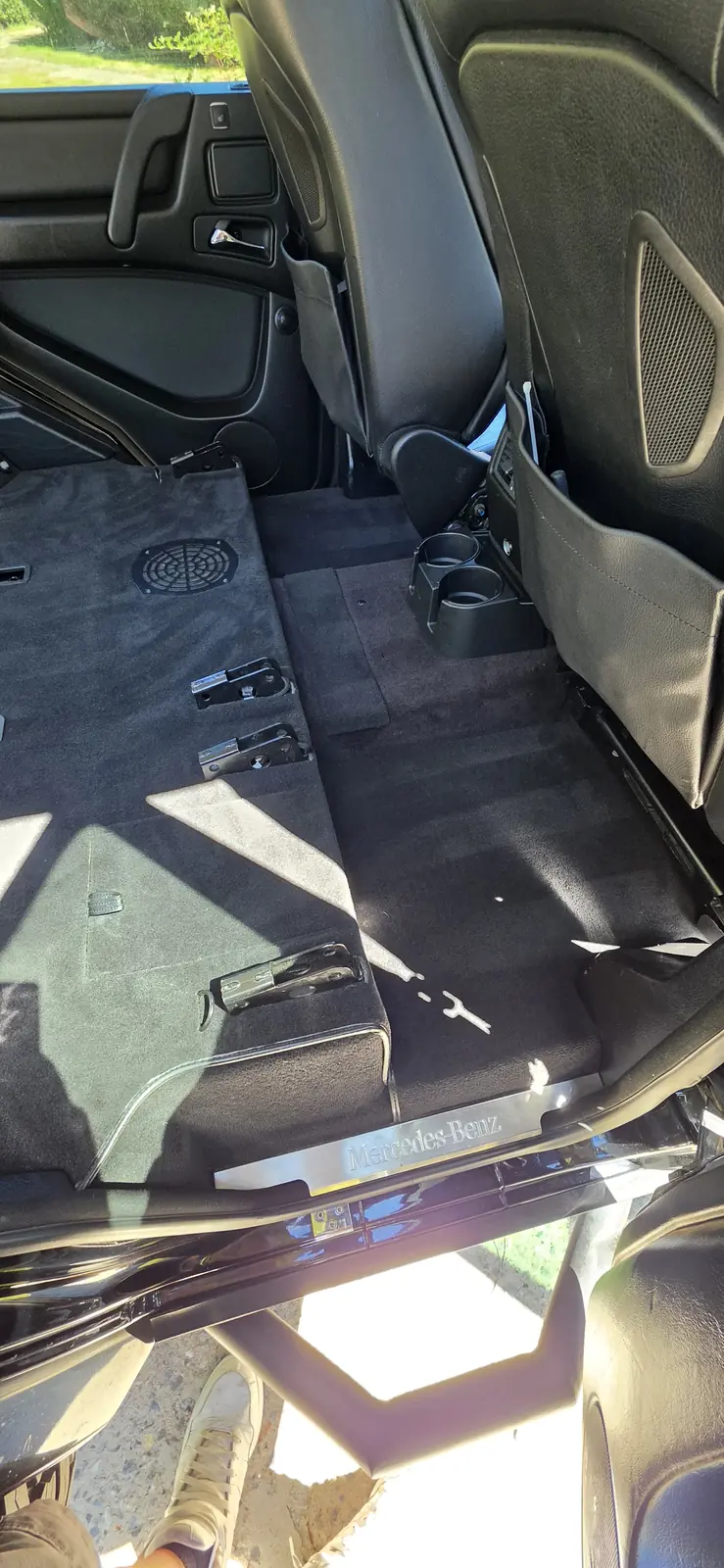Rear seats and carpets of a Mercedes G-Class cleaned back to black