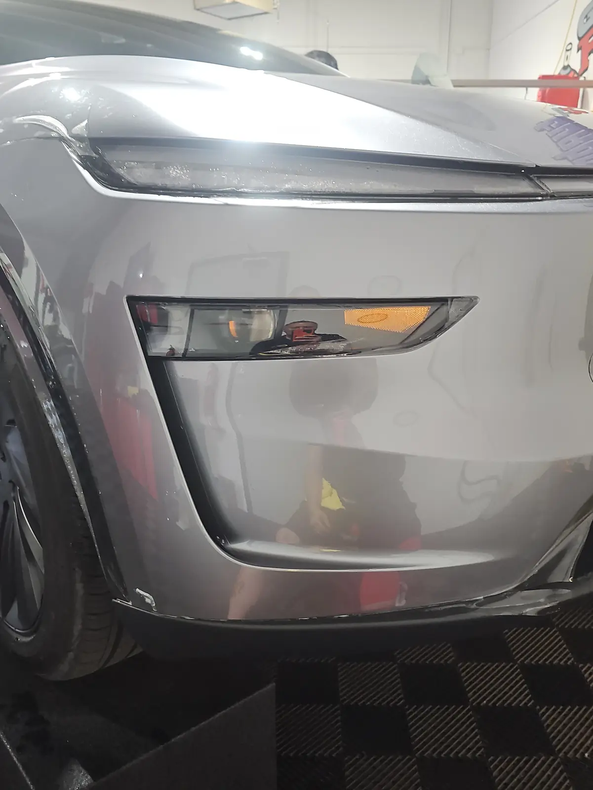 Front bumper with paint protection film applied