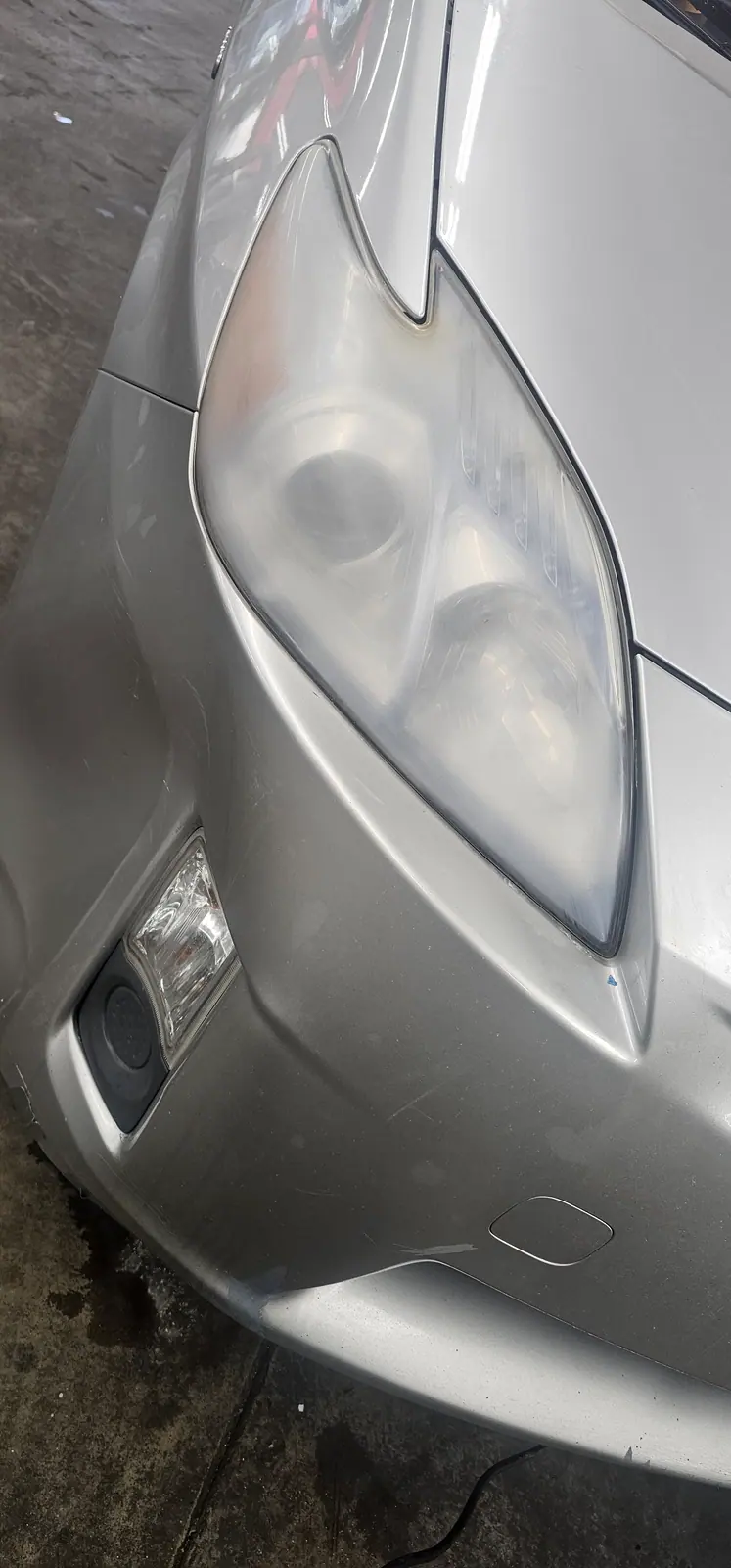 Yellowed headlight lens before restoration