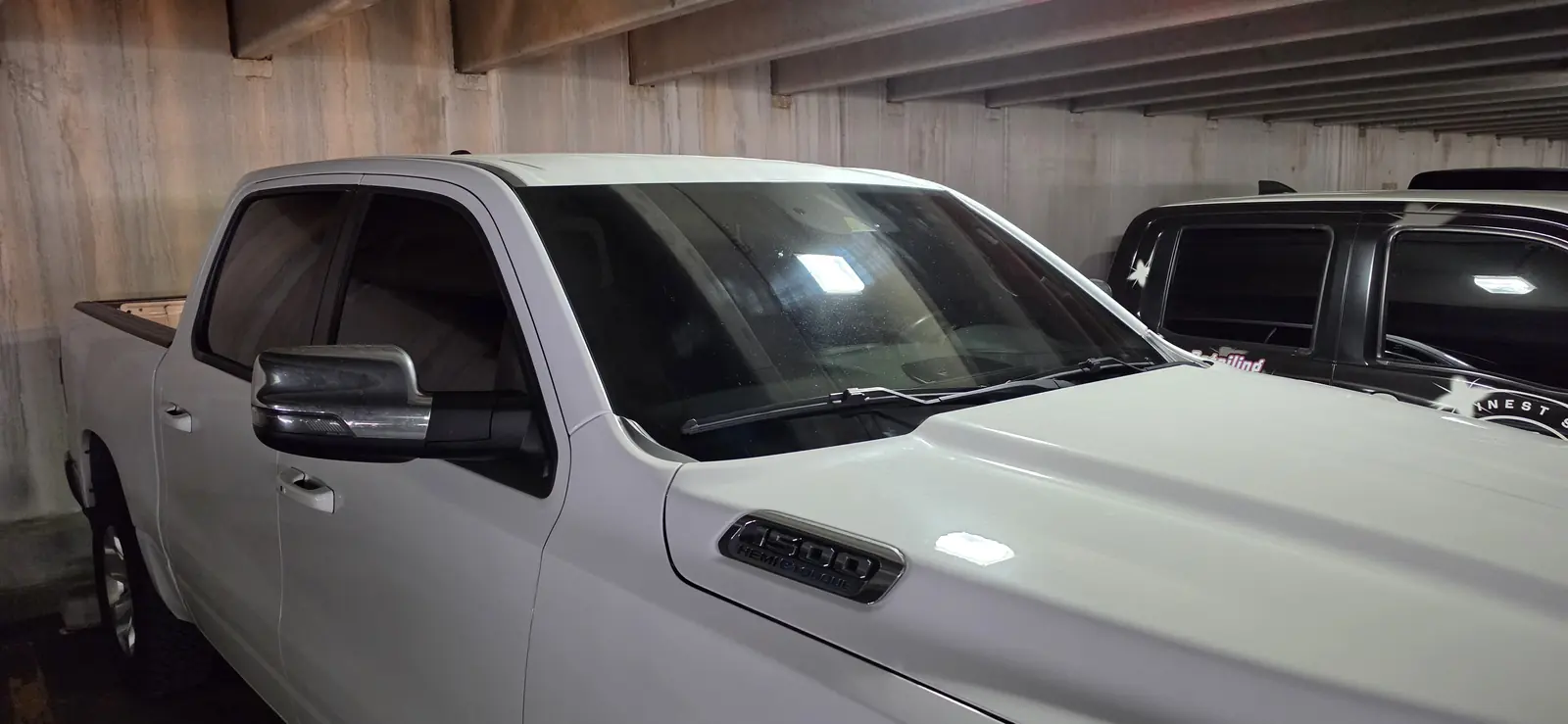 White Ram 1500 after a full window tint, front three quarter view