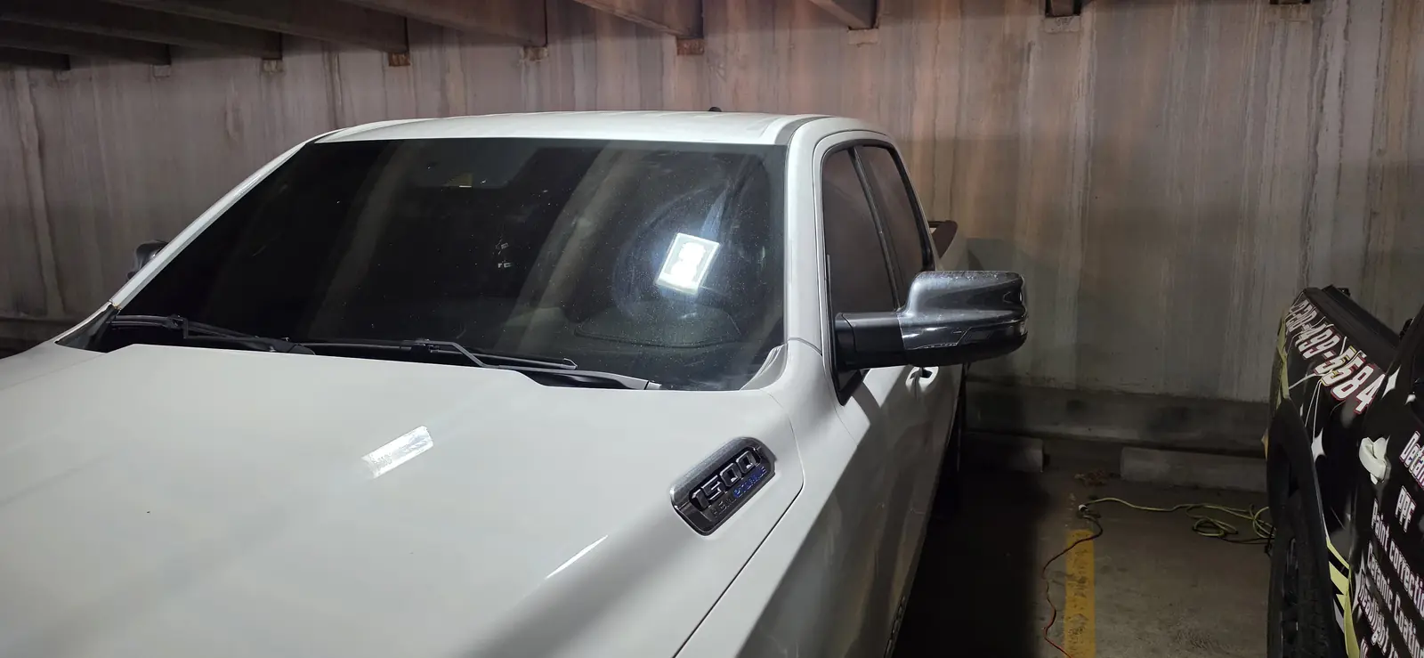 Newly tinted side glass on a white Ram 1500