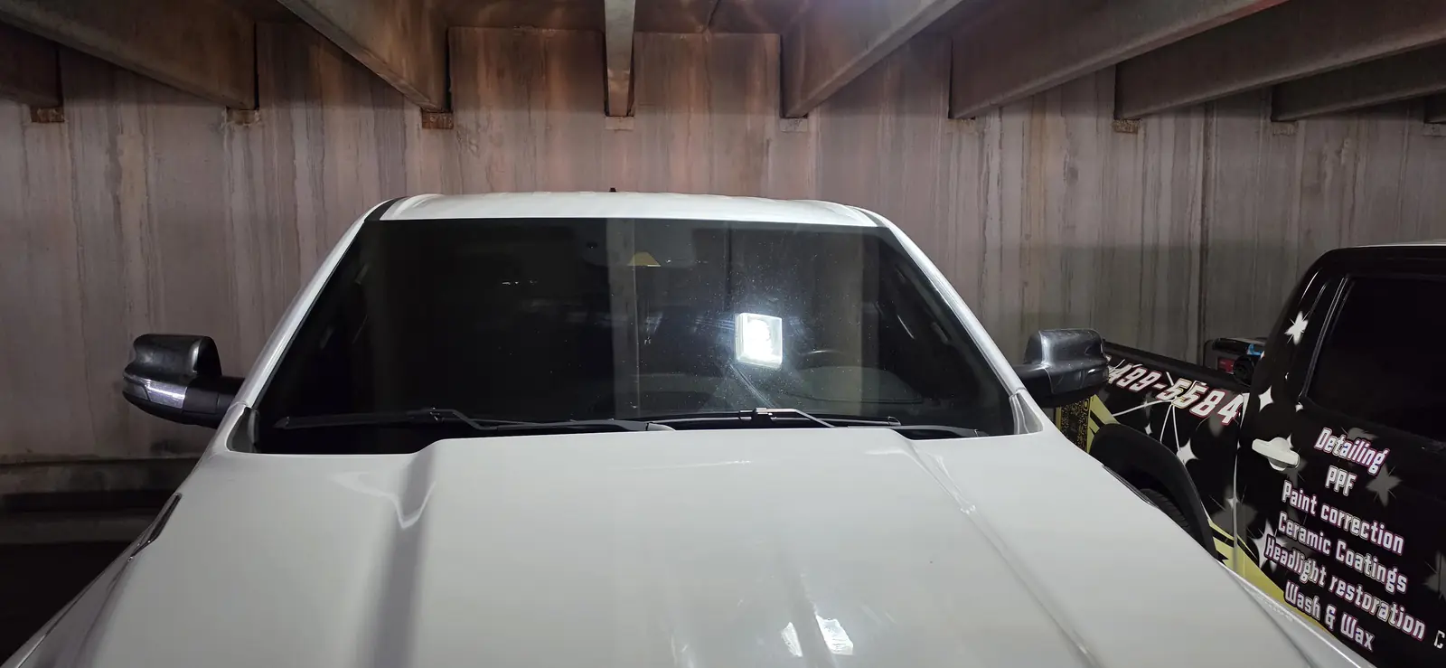 Ram 1500 with a freshly tinted windshield strip and front glass
